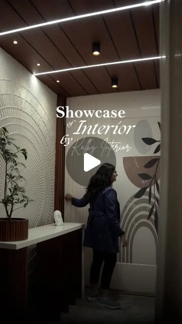 Entrance foyer with fluted panelling and wall art by Kalky Interior, video thumbnail from Instagram