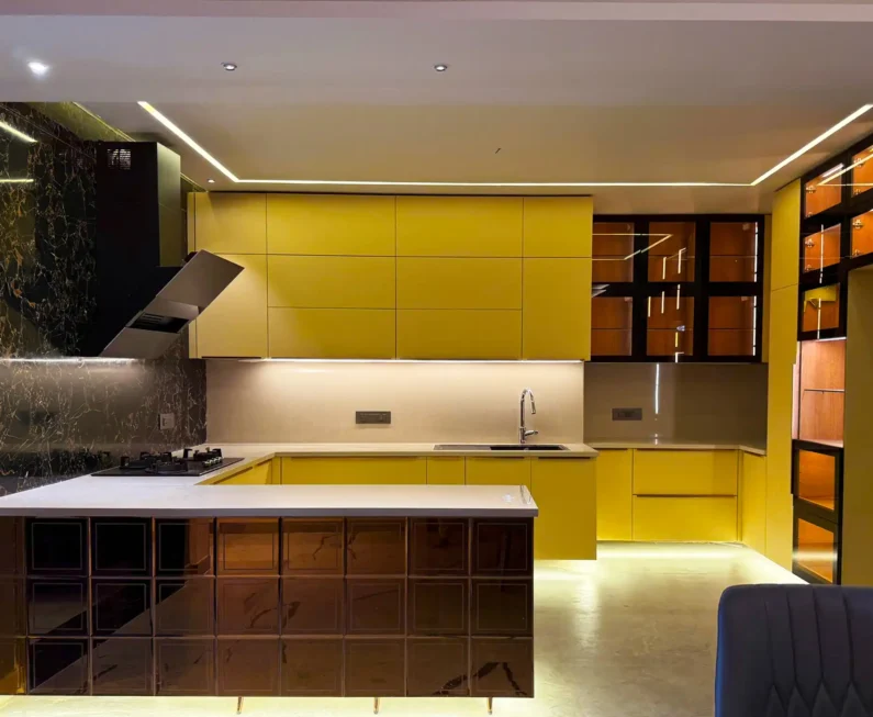 Yellow modular kitchen by Kalky Interior in Bhubaneswar