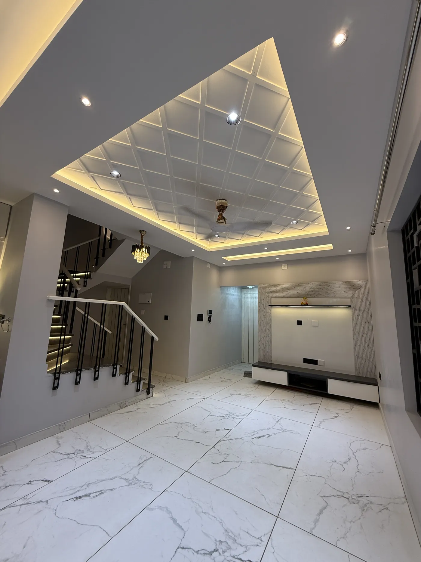 Coffered false ceiling with concealed cove lighting