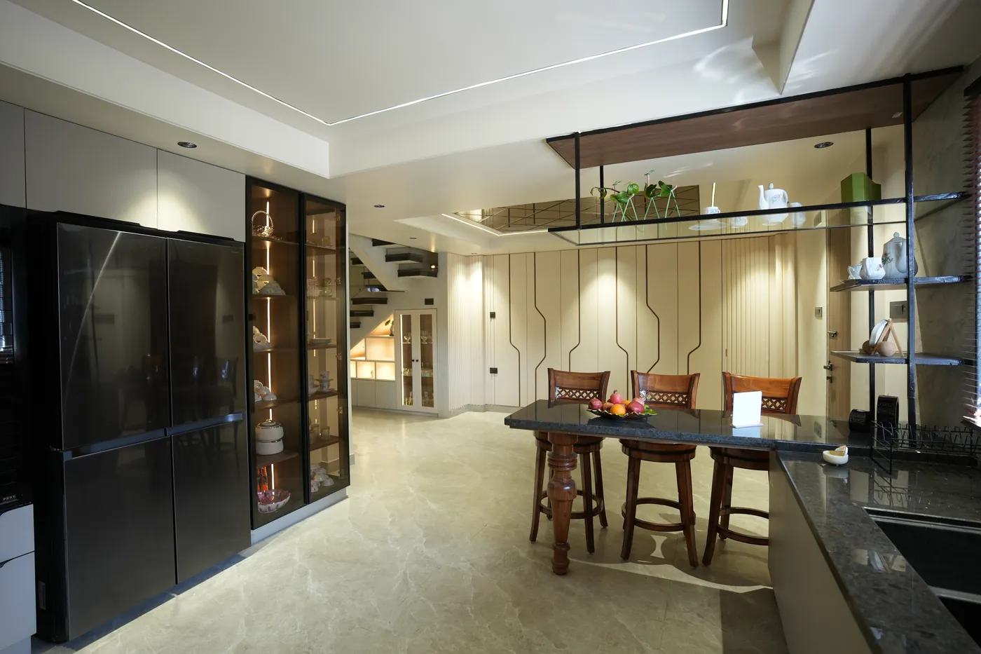 Open dining and kitchen space with tall display units