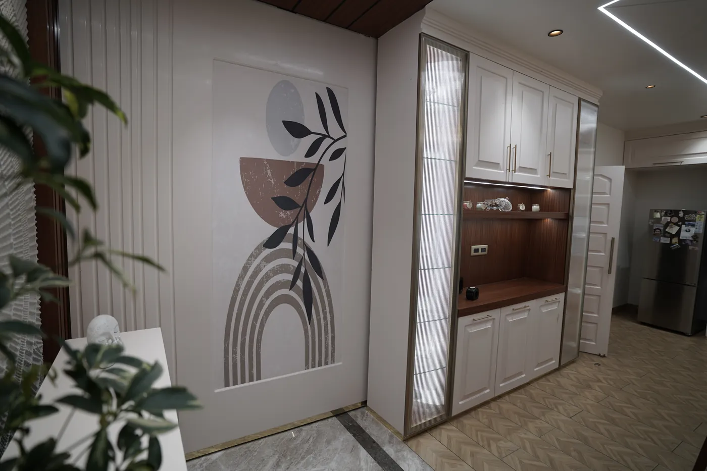 Entrance foyer with a printed feature panel and full-height storage