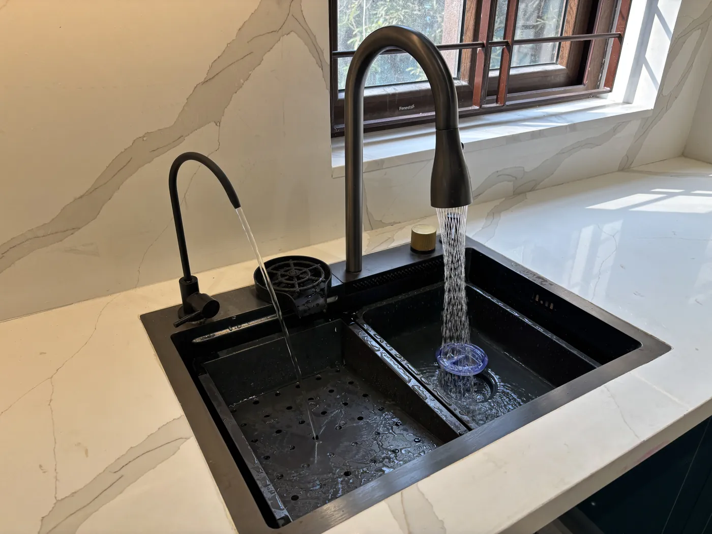 Black granite composite sink with a pull-down mixer tap
