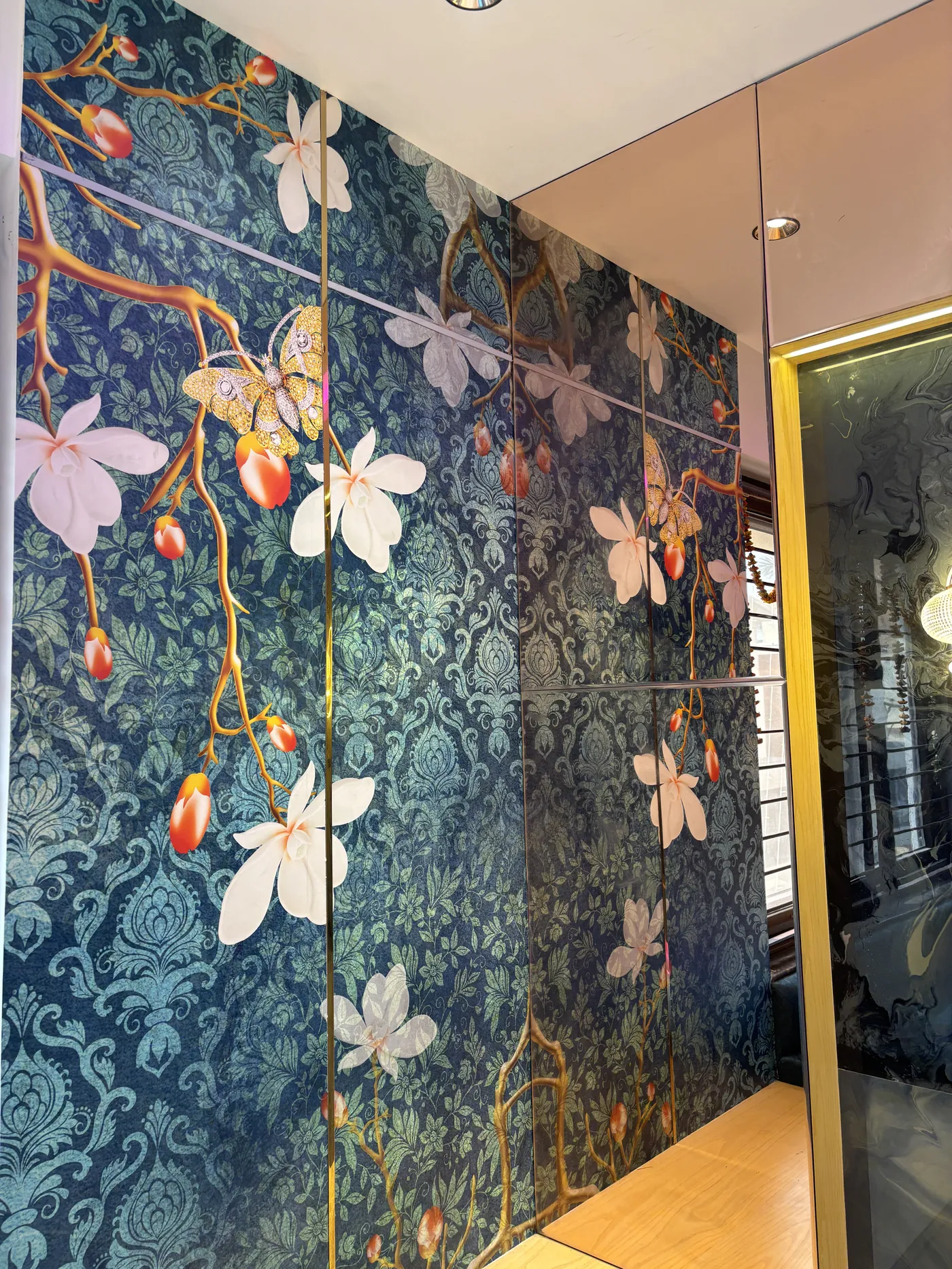 Magnolia patterned wall panel in teal and gold